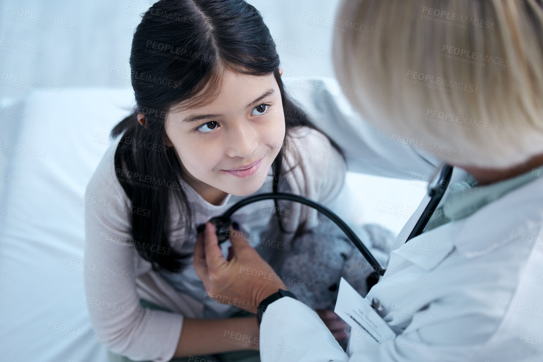 Buy stock photo Shot of a little girl getting a checkup at the clinic