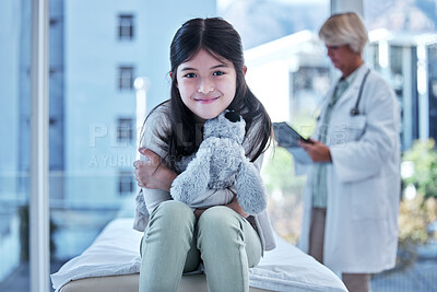 Buy stock photo Shot of a little girl getting a checkup at the clinic