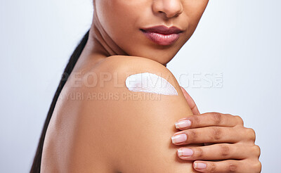 Buy stock photo Shoulder, skincare cream and product in studio with hand, moisturiser or sunscreen application by white background. Closeup, skin and self care for beauty, cosmetics and natural glow by backdrop