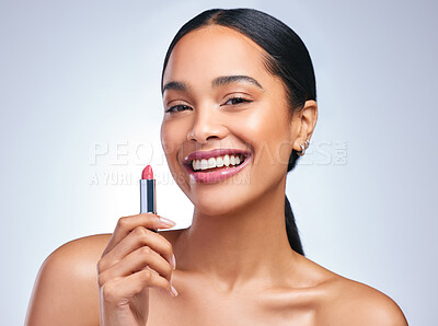 Buy stock photo Portrait of a beautiful young woman posing with her perfect shade of lipstick against a grey background