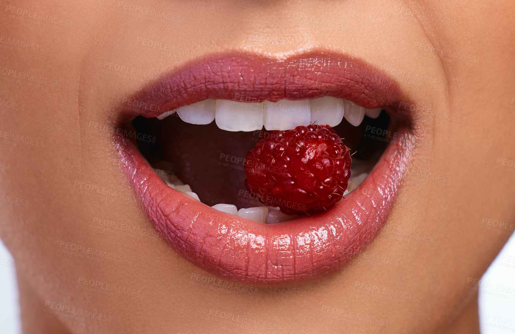 Buy stock photo Woman, teeth and mouth with lipstick and raspberry for dental care, hygiene and oral health. Model girl, cosmetics and fruit for smile in studio with glow, wellness and vegan for diet or results 