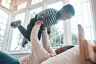 Buy stock photo Home, boy and African mom playing, air and fun for family in weekend, together and smile with love and relax. Black woman, kid and child on break, youth and mother enjoy time for game of airplane