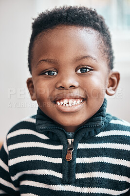 Buy stock photo Shot of an adorable little boy sitting at home