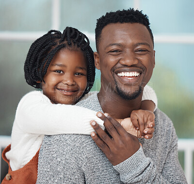 Buy stock photo Shot of an adorable little girl hugging her father while bonding at home