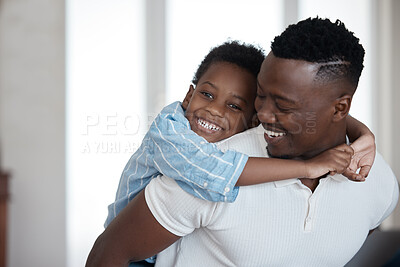 Buy stock photo Cropped portrait of an adorable little boy being piggybacked around the living room by his dad