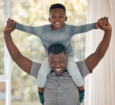 Buy stock photo Cropped portrait of a handsome young man standing in the bedroom at home with his son on his shoulders