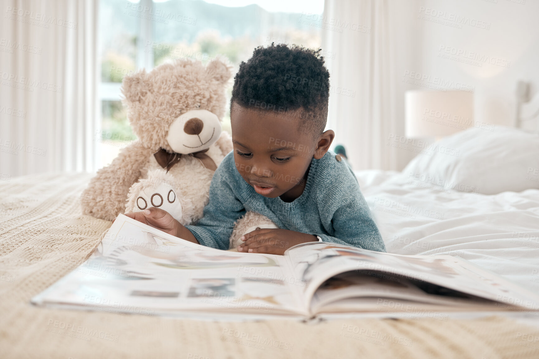 Buy stock photo Black kid, learning and reading book in home bedroom, storytelling and knowledge. African child, boy and read books for education, development or studying for homeschool, story time or relax in house