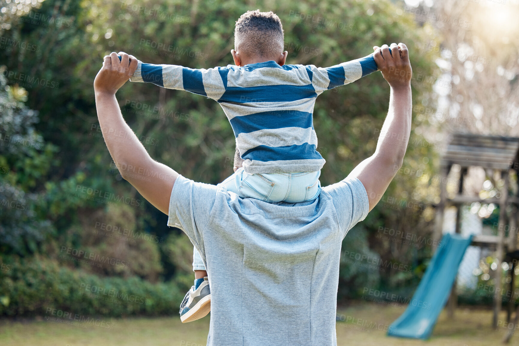 Buy stock photo Shoulder, father or back of child in park for support in nature for care, safety or bonding together to relax. Holding hands, love or single parent dad with kid for security or growth in black family