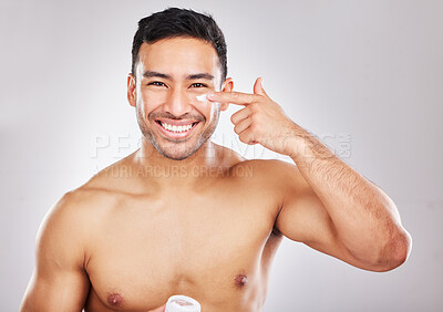 Buy stock photo Face, portrait and man with lotion in studio for skin hydration, anti aging and collagen. Moisturizer, male model and skincare with cosmetics for smooth, glowing and soft texture by white background