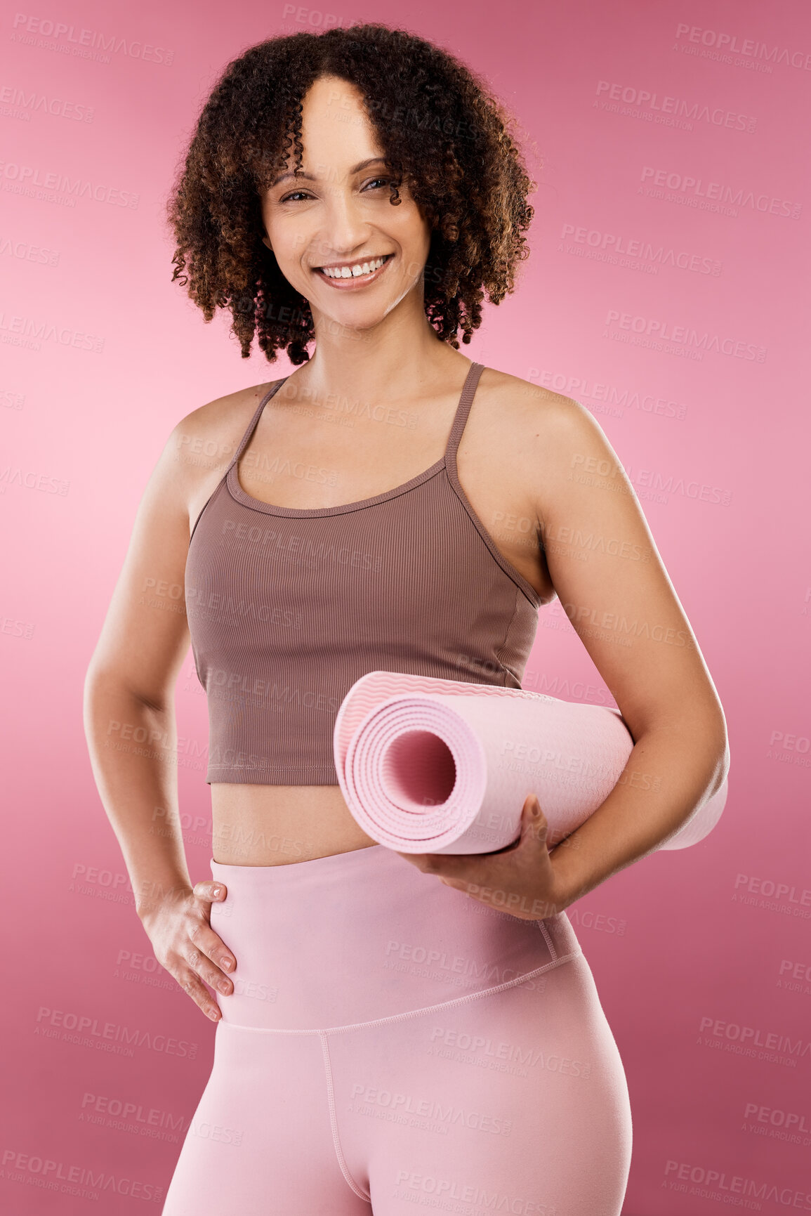 Buy stock photo Cropped portrait of an attractive young female athlete posing in studio against a pink background