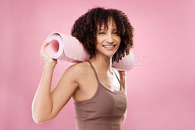 Buy stock photo Cropped portrait of an attractive young female athlete posing in studio against a pink background