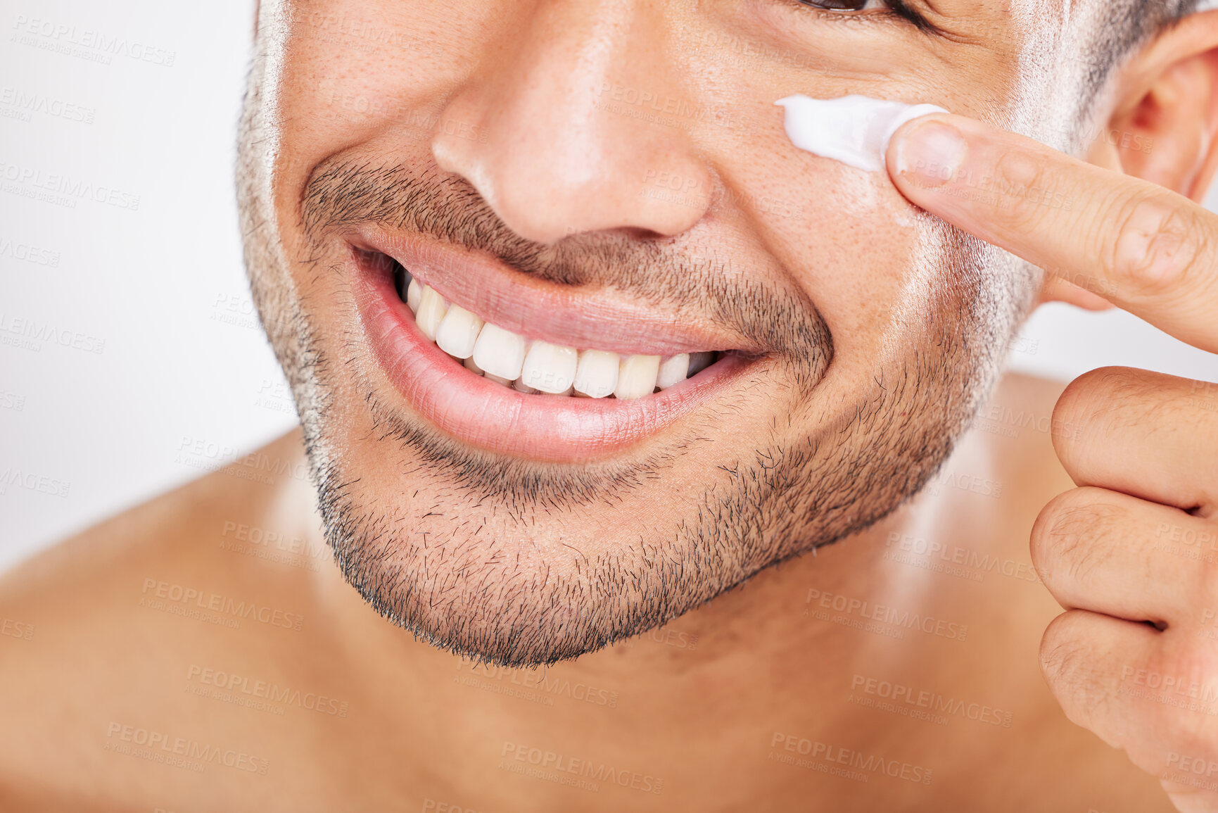 Buy stock photo Happy man, hand or face cream closeup for beauty in studio with smile, natural cosmetics or glow for shine. Dermatology, antiaging or male model applying skincare lotion or creme on white background