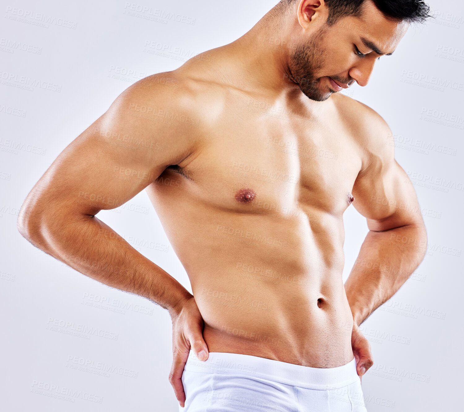 Buy stock photo Shot of a man posing in his underwear against a white studio background