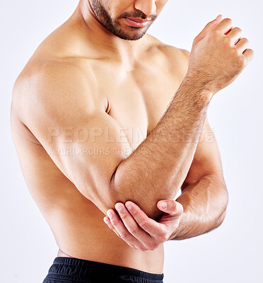 Buy stock photo Muscular man, elbow and bone with pain from accident, fall or injury on a white studio background. Closeup of male person or bodybuilder with sore arm, muscle or joint from tension or inflammation