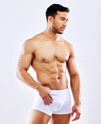 Buy stock photo Thinking, fitness and man in underwear on studio, white background or bodybuilder mockup. Healthy, athlete and body of model with abs or muscle from exercise, workout or progress at gym with goals