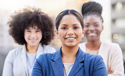 Buy stock photo Shot of a diverse group of businesswomen standing together on the balcony outside