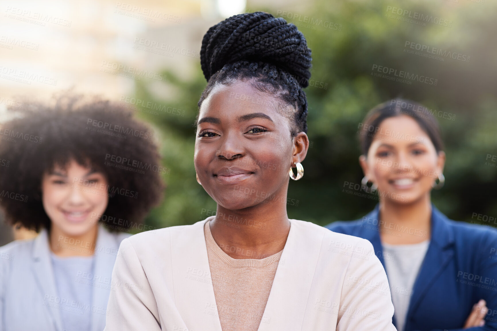 Buy stock photo Shot of a diverse group of businesswomen standing together on the balcony outside