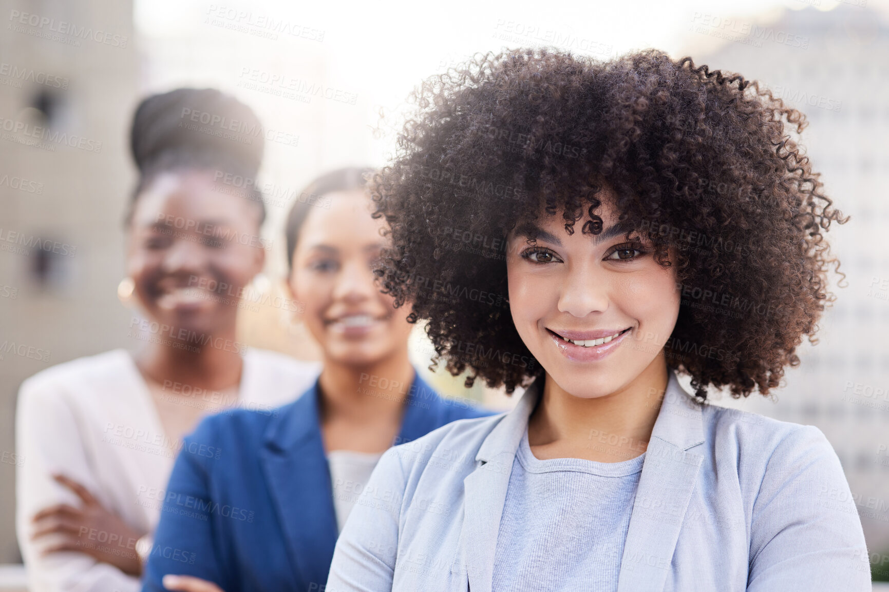 Buy stock photo Shot of a diverse group of businesswomen standing together on the balcony outside