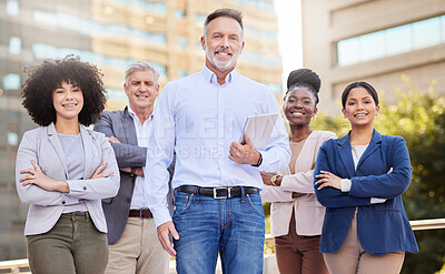 Buy stock photo Shot of a diverse group of businesspeople standing together on the balcony outside