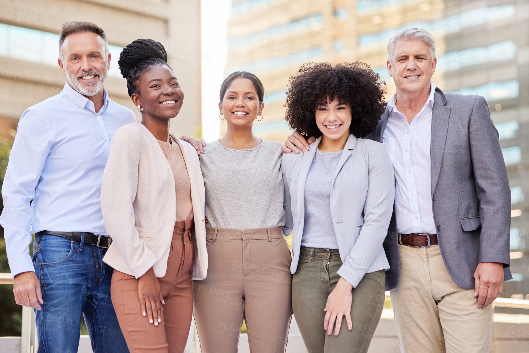 Buy stock photo Shot of a diverse group of businesspeople standing together on the balcony outside