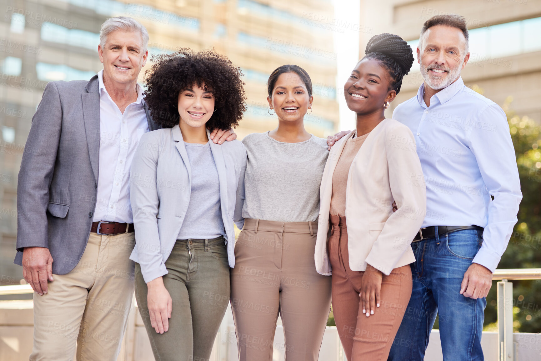 Buy stock photo Shot of a diverse group of businesspeople standing together on the balcony outside