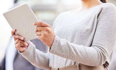 Buy stock photo Cropped shot of an unrecognisable businesswoman standing on the balcony outside and using a digital tablet