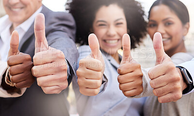 Buy stock photo Shot of a diverse group of businesspeople standing outside on the balcony together and showing a thumbs up