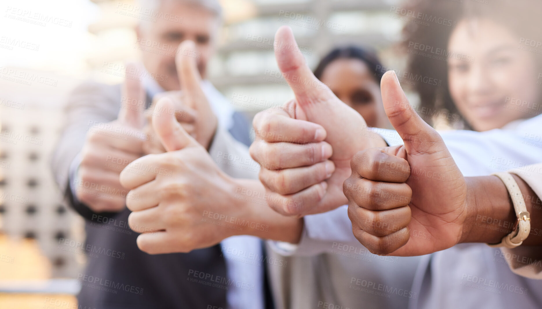 Buy stock photo Shot of a diverse group of businesspeople standing outside on the balcony together and showing a thumbs up