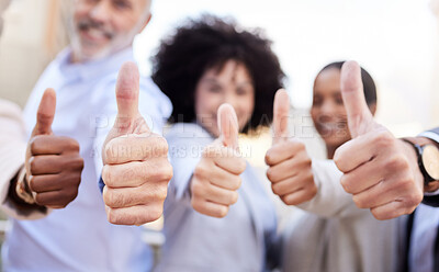 Buy stock photo Shot of a diverse group of businesspeople standing outside on the balcony together and showing a thumbs up