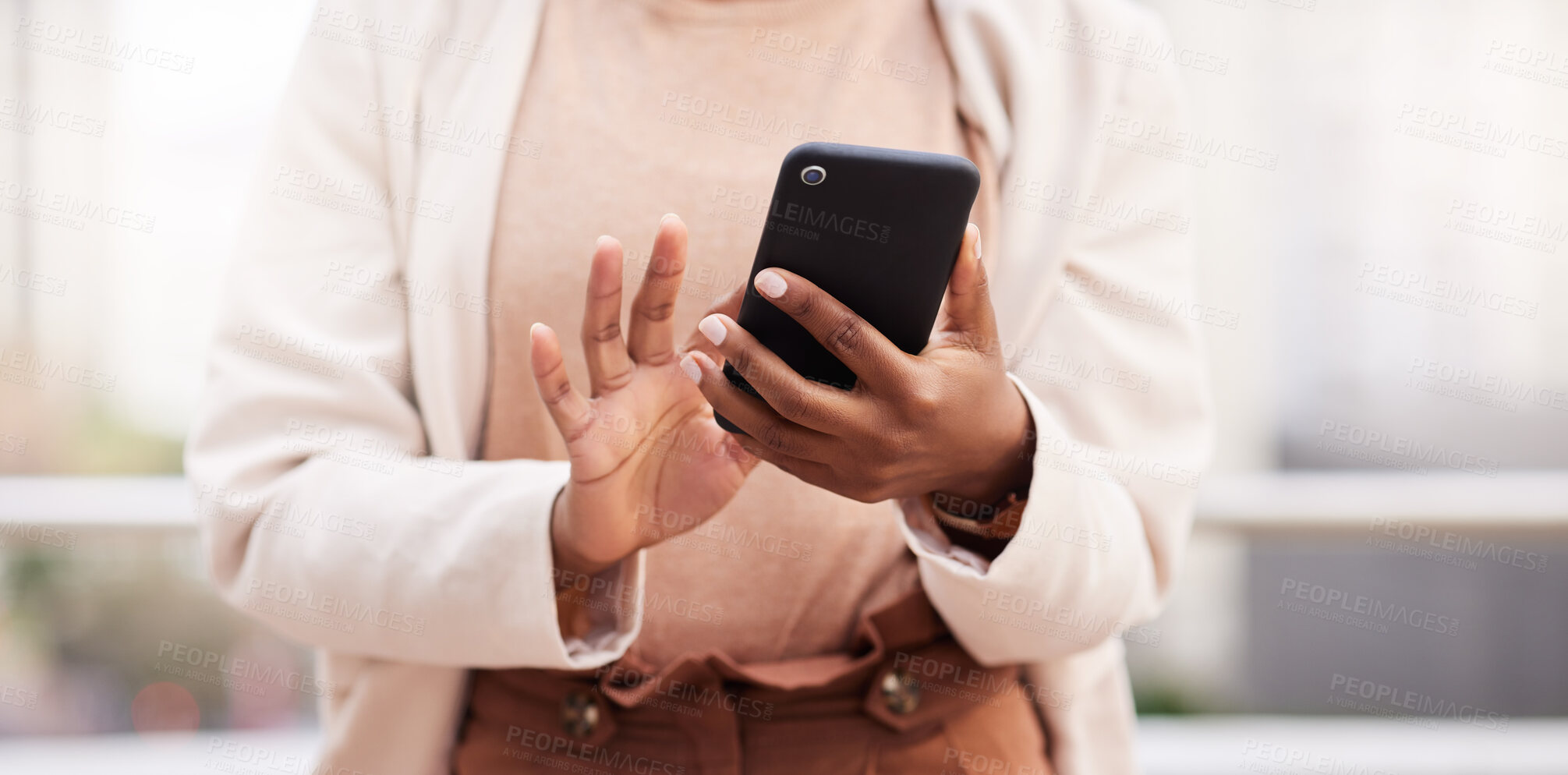 Buy stock photo Cropped shot of an unrecognisable businesswoman standing alone on the balcony outside and using her cellphone