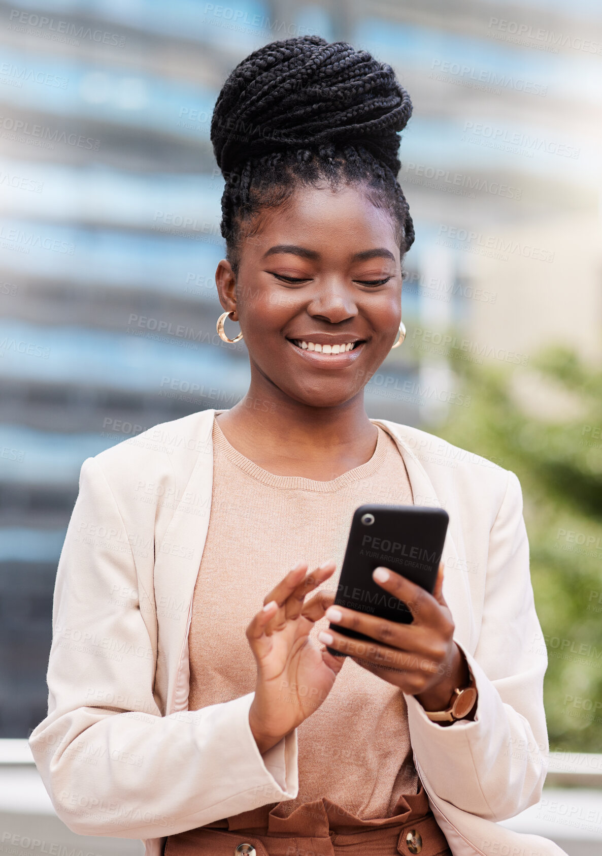 Buy stock photo Shot of an attractive young businesswoman standing alone on the balcony outside and using her cellphone