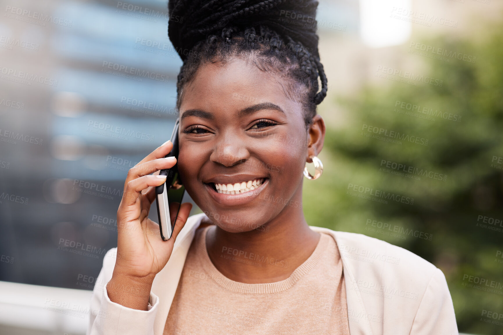 Buy stock photo Shot of an attractive young businesswoman standing alone on the balcony outside and using her cellphone