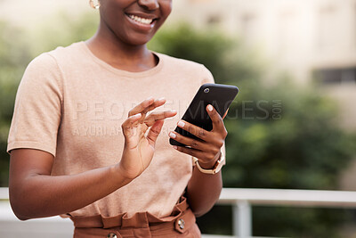 Buy stock photo Cropped shot of an unrecognisable businesswoman standing alone on the balcony outside and using her cellphone