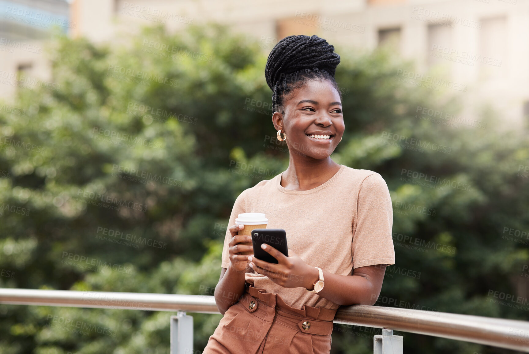 Buy stock photo Shot of a young businesswoman standing on the balcony outside and using her cellphone while holding a cup of coffee