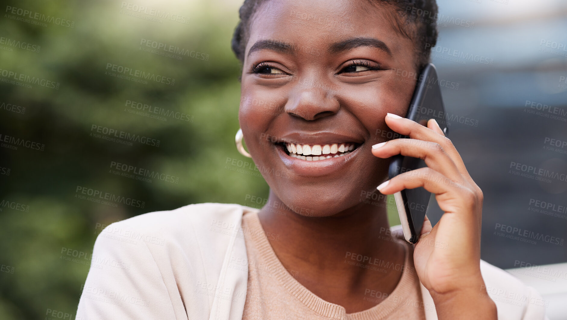 Buy stock photo Shot of an attractive young businesswoman standing alone on the balcony outside and using her cellphone