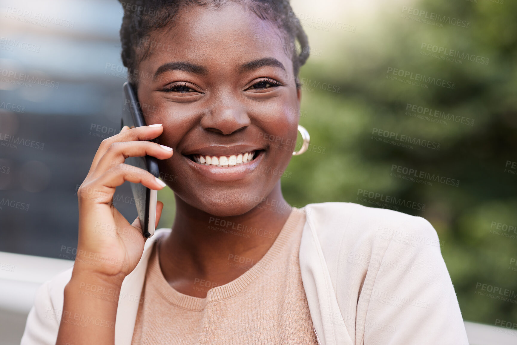 Buy stock photo Shot of an attractive young businesswoman standing alone on the balcony outside and using her cellphone