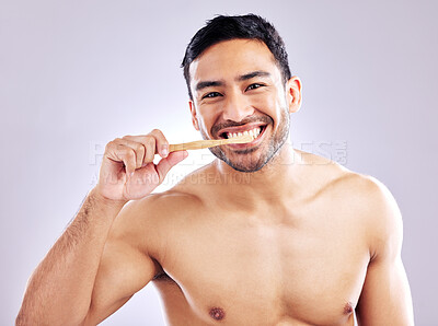 Buy stock photo Studio, portrait and man with toothbrush for teeth, wash and routine of hygiene in morning and dental. Oral health, wellness and person with smile in white background, grooming and cleaning of tooth