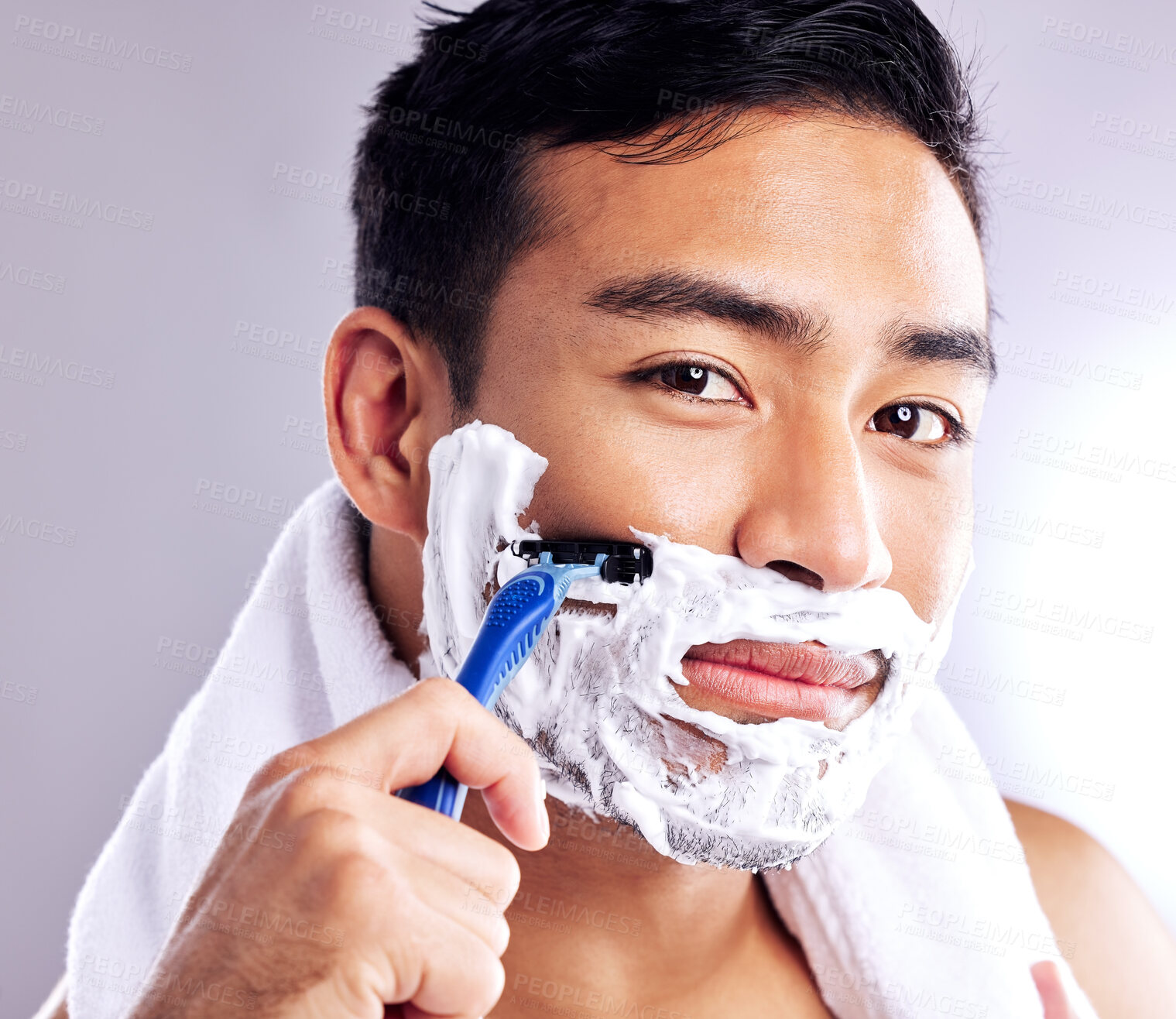 Buy stock photo Portrait, man and shaving face with razor in studio for cleaning, health or hair removal for hygiene isolated on white background. Cream, foam and model cut beard for skincare, grooming or beauty
