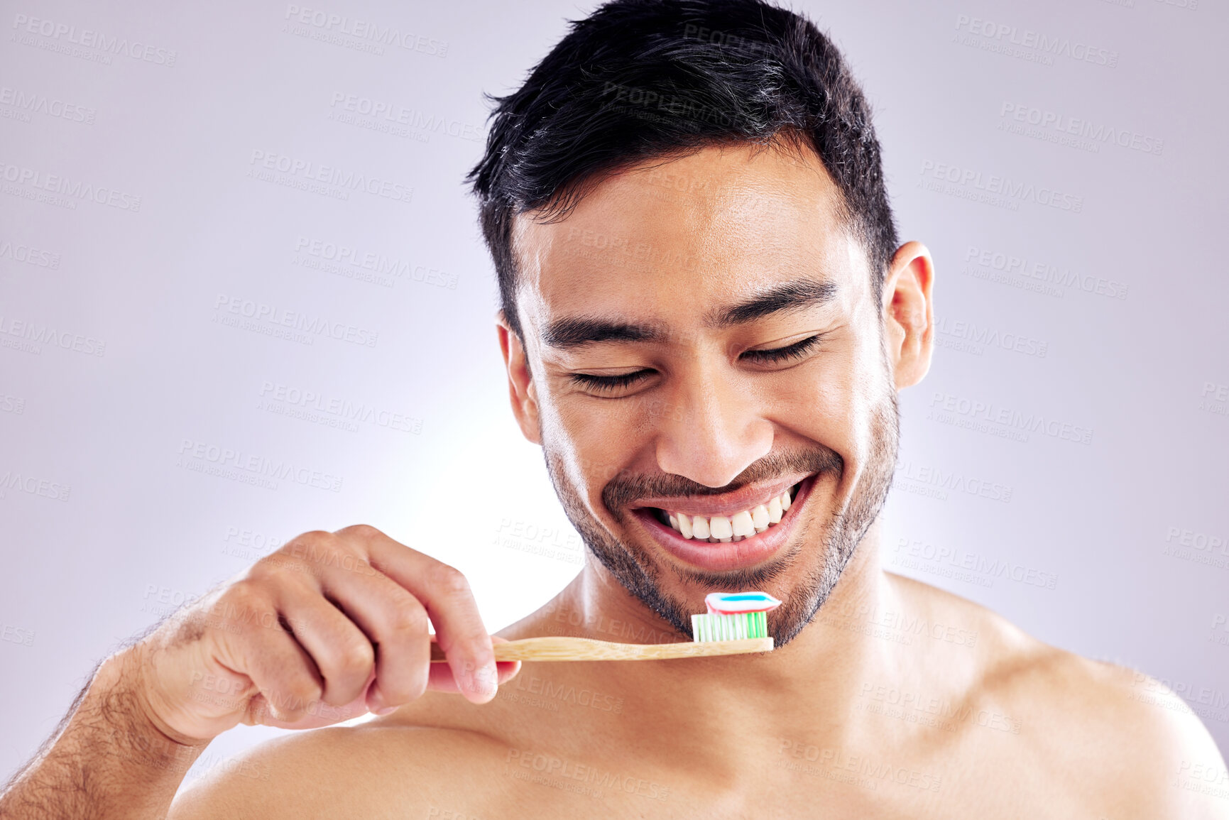 Buy stock photo Man, smile with toothpaste and studio background for dental hygiene, cleanliness and wellness. Male person, happy or confident with toothbrush for mouth odor, freshness and brushing or whitening
