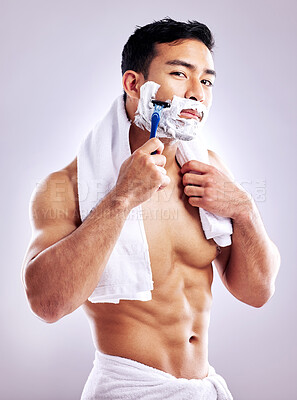 Buy stock photo Body, portrait and man shaving face in studio for cleaning, health and hair removal for hygiene isolated on white background. Cream, shirtless and razor on beard for skincare, grooming or muscle