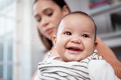 Buy stock photo Shot of an adorable baby bonding with his mother at home