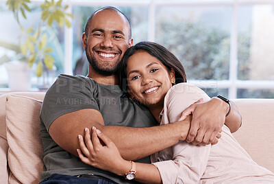 Buy stock photo Shot of a happy young couple relaxing together at home