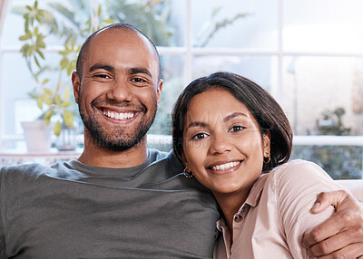 Buy stock photo Portrait of a happy young couple relaxing together at home