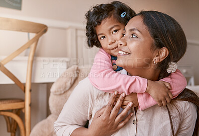 Buy stock photo Shot of a little girl hugging her mother at home