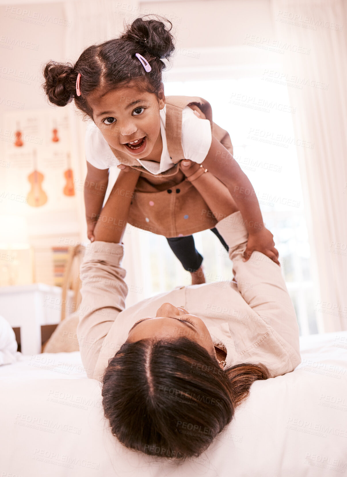 Buy stock photo Shot of a little girl playing with her mother at home