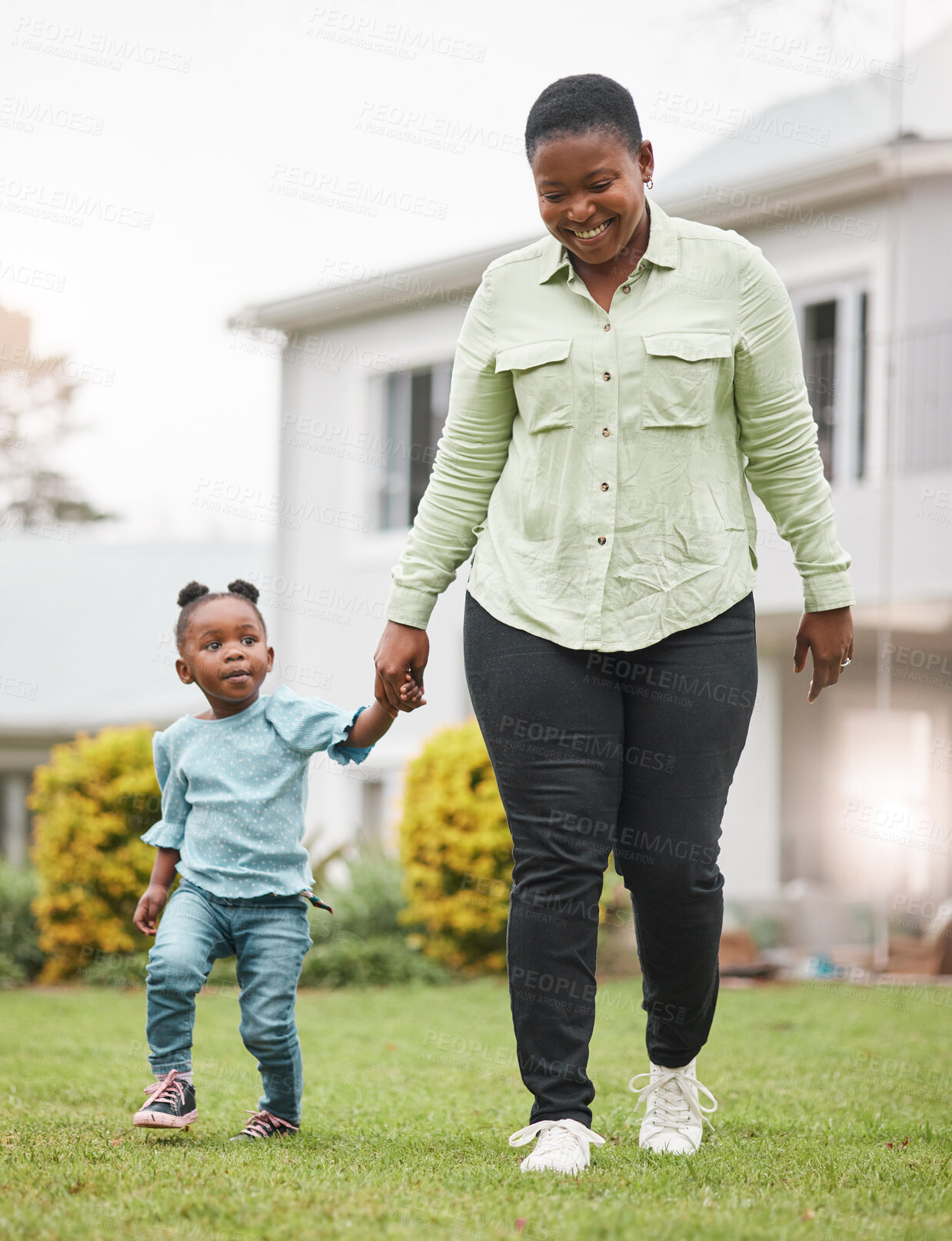 Buy stock photo Shot of a mother and her little daughter bonding together outdoors