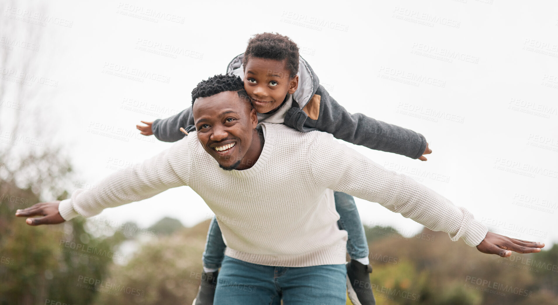 Buy stock photo Portrait of a father and his son having fun while bonding together outdoors