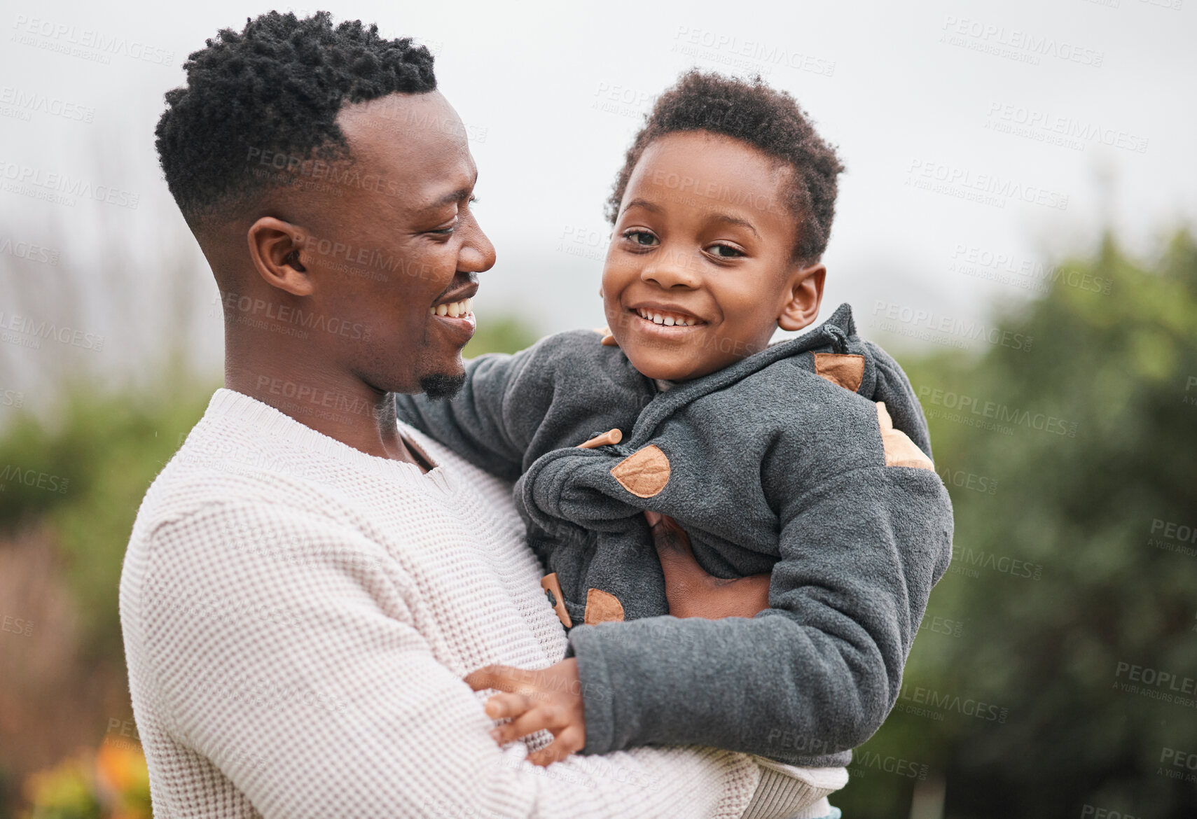 Buy stock photo Portrait of an adorable little boy being carried by his father while bonding together outdoors