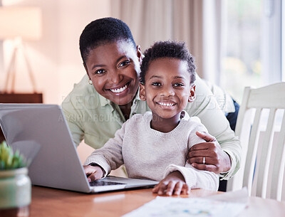 Buy stock photo Shot of a mother helping her son with his homework at home