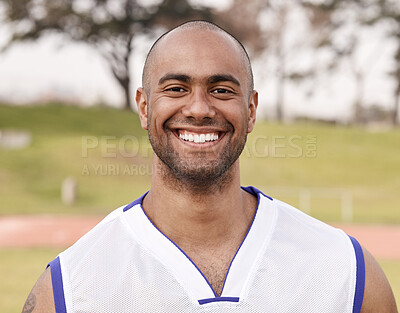Buy stock photo Shot of a handsome young man standing alone outside while playing sports